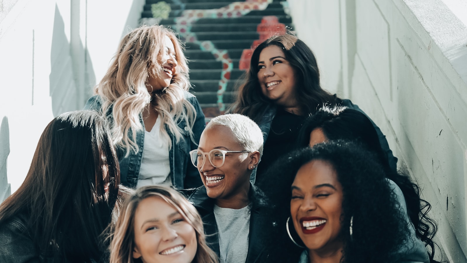 A parent gently holding and comforting a crying infant